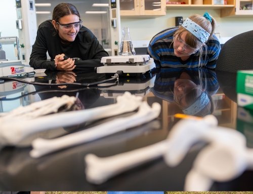 Two female students wearing protective eyewear in the chemistry lab at the Saratoga Center